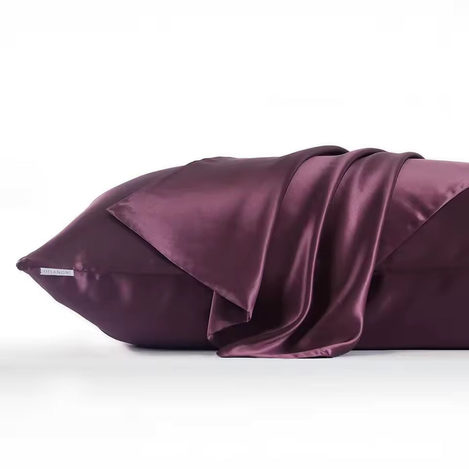 Purple satin pillowcase on a white background